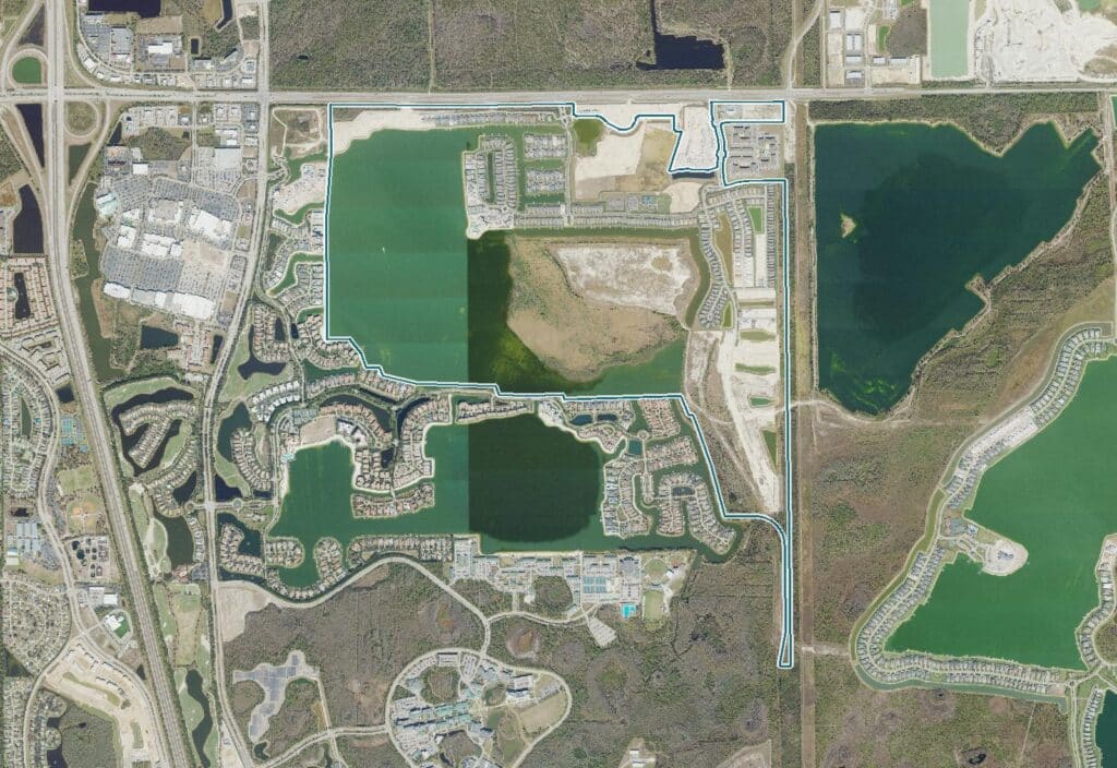 Aerial view of Esplanade Lake Club, Fort Myers, FL, around Lake Como, with the community boundary outlined