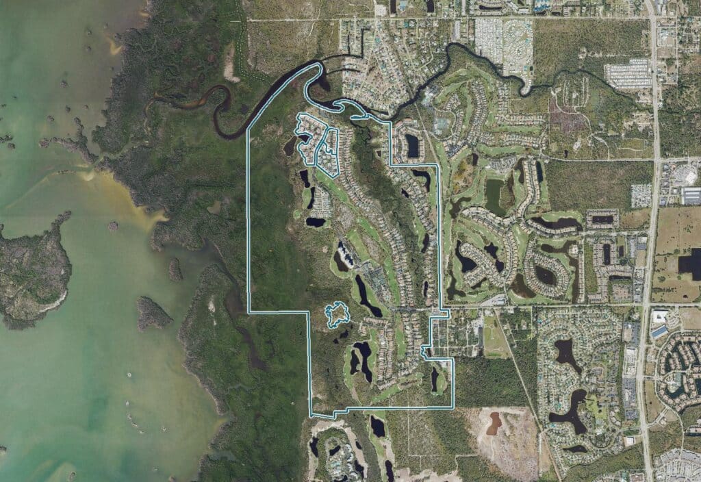 Aerial view of West Bay Club, Estero, FL, with the community boundary outlined